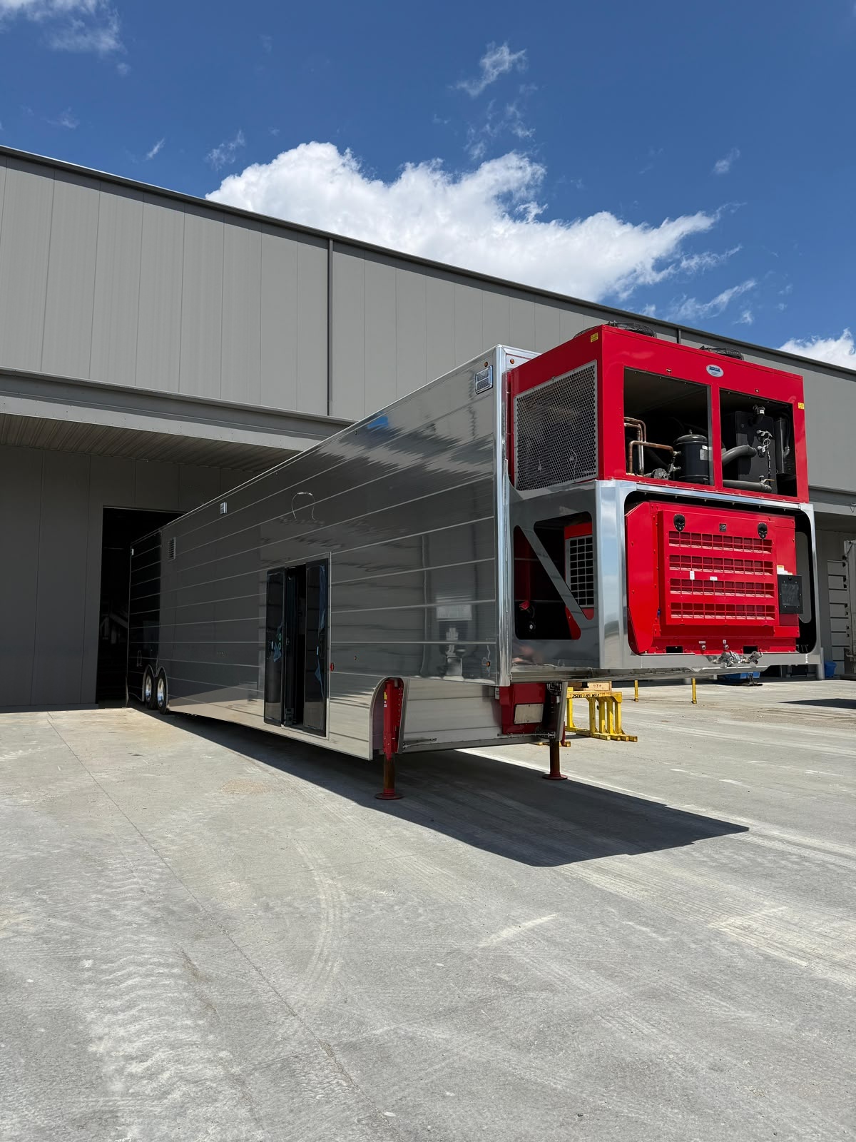 Apex WalkIn MRI trailer with its double sliding doors open at the step-free entrance